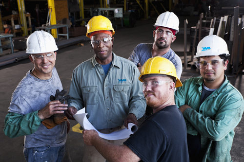 VAM USA team members huddle up to review documentation